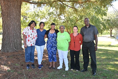 Winners are (left to right) Brenda McNair, Donielle McGlaston, Anjuana Owens, and Evonne Rhodes; Congratulating the Winners are (fourth from the left) Andrea Walters, Prog. Admin.; John Wilson, NHA.