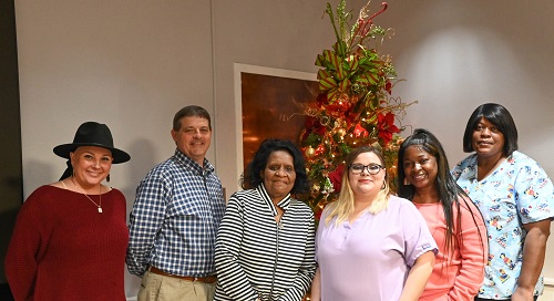 Congratulating the Winners are (left to right) Andrea Walters, Prog. Admin.; Kevin Polk, Dir. Of Prog. Serv.; and Thelma Orange, Nursing Home Admin. Assist.; Winners are (fourth from the left to right) Destany Eddy, Latasha Cooper, Brenda McNair, and Carolyn Barboza (Not Pictured).