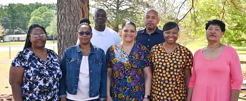 Congratulating the Winners (Back Left to Right) John Wilson, Nursing Home Administrator; Eric Caples, Director of Units; (Front Left to Right) Tasheba Simpson, Support Care Professional Supervisor; Margo Knighton, NHA Assistant; Winners are (Starting Beginning Third Left to Right) Alicha Liggins, Anjuana Owens, Liza Lyman, and Arquita Craft (not pictured).