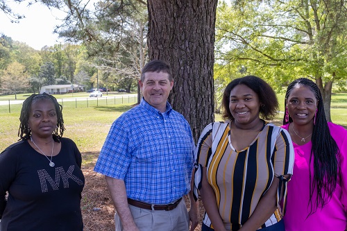 (Left to Right): Kadrain Washington, ATT in Prentiss Community Home, Kevin Polk, blank, Winner Jamiah Gammage, and Georgette Powell, Director of Prentiss Community Home. (Not in photo: Christy Smith, Shannon Morgan, and Stephanie Allen)