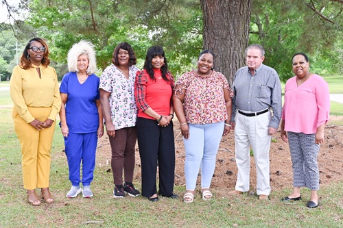 (Left to Right): (Administrator) Georgette Powell, Director of Prentiss Comm. Homes; Betty Butler, Brenda McNair, Kimetha Flowers, Sheena Crosby, (Administrators) Dr. Kenneth O’Neal, Asst. Dir. Of ESS; Cathy Lindsey, Shift Supervisor Coord.; (Winners Not Pictured: Ashley Oxner, Denise Cooley, Malcolm Rucker, & Georgia Moffett).