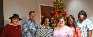 Congratulating the Winners are (left to right) Andrea Walters, Prog. Admin.; Kevin Polk, Dir. Of Prog. Serv.; and Thelma Orange, Nursing Home Admin. Assist.; Winners are (fourth from the left to right) Destany Eddy, Latasha Cooper, Brenda McNair, and Carolyn Barboza (Not Pictured).