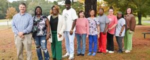 (Left to Right): (Administrators) Kevin Polk, Director of Units; (Winners) Clotee Feazell, Felinda Kelly, Andre McDonald, Shannon Bates, Kendra Lyons, Stephanie Allen, Lisa Holifield, Monique Terrell; (Administrators) Candy Maxey, Assistant Director of ESS.
